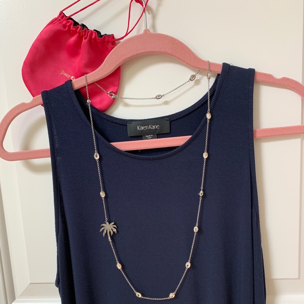 Juicy couture Long silver and rhinestone necklace.